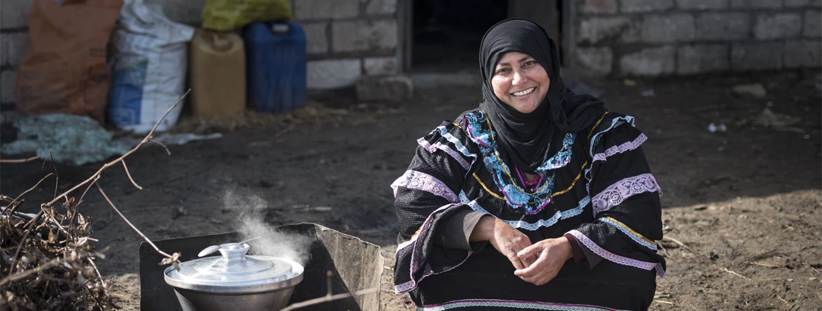 Woman cooking outside
